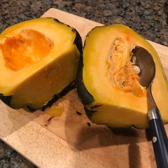 Cut squash in half and scoop out the seeds in the middle