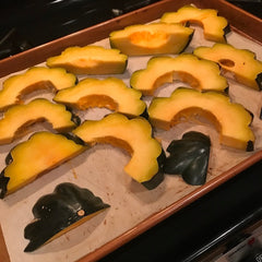 arrange the cut squash slices onto the baking sheet and put back in the oven