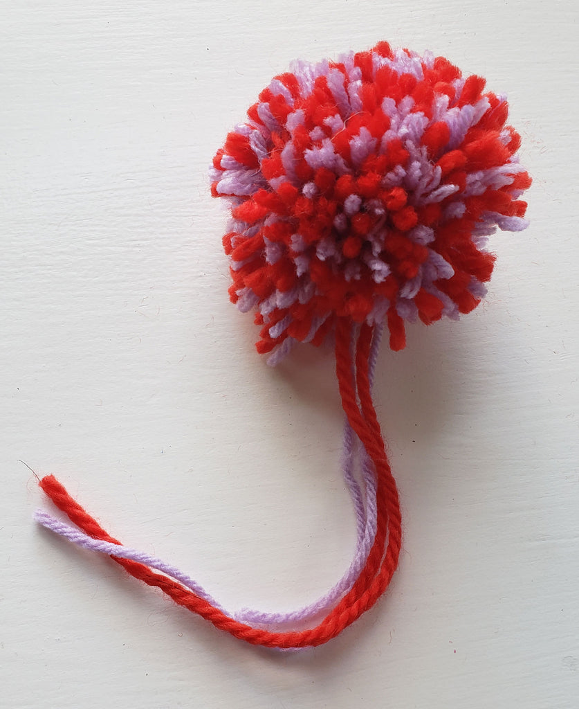 Red and purple pom pom