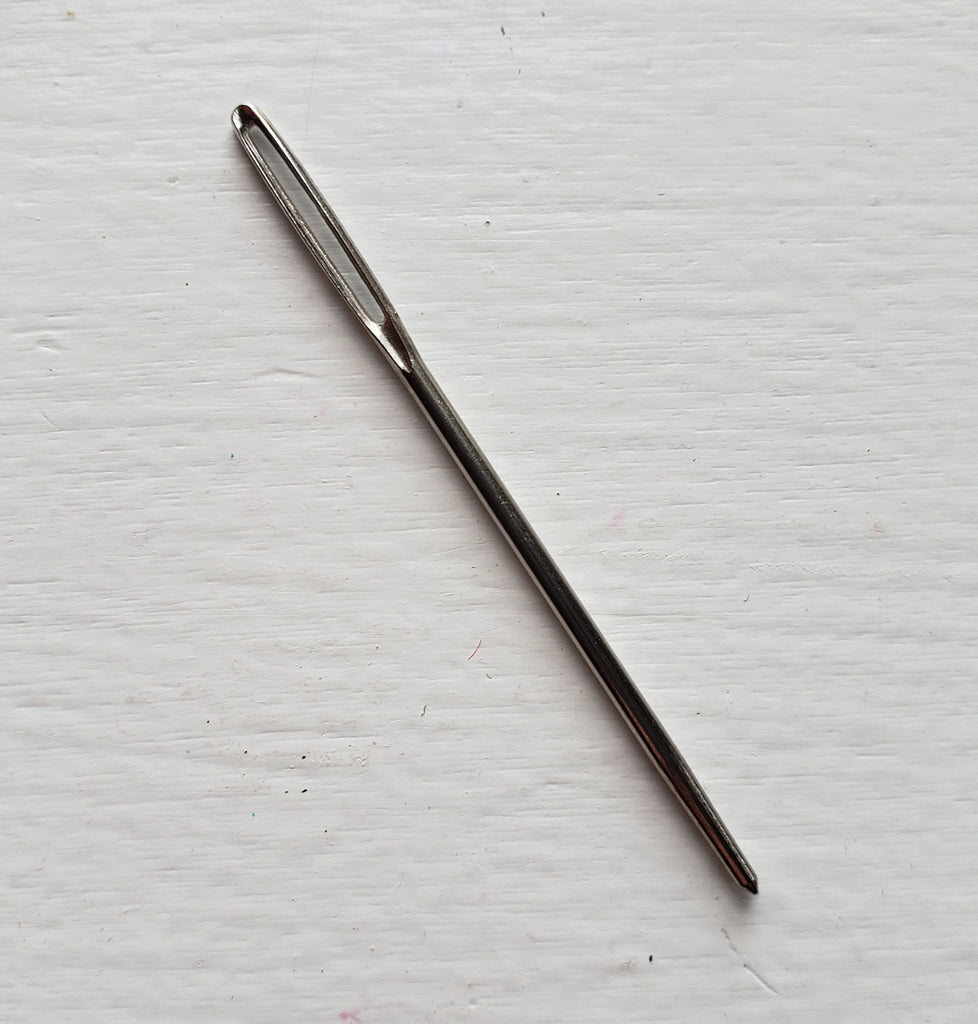 A tapestry hand sewing needle with a large eye