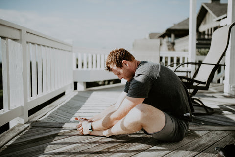 Man stretching outside