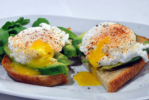 Runny eggs over spinach and toast