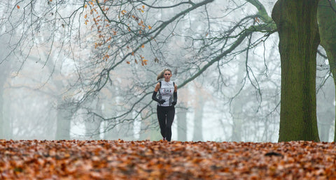 Person running outdoors in the fall