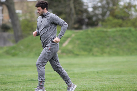 Man in gray suit running