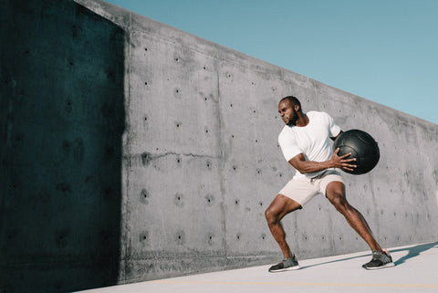 Man working out with an exercise ball