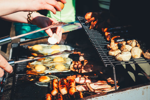 Barbeque with different types of food on the grill