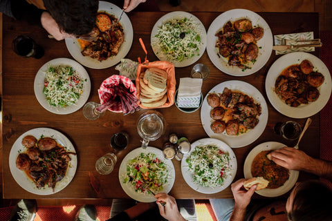 Family dinner table with many dishes