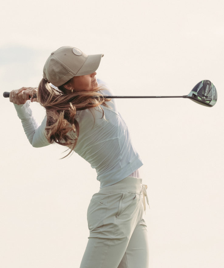 Man Squatting on golf course