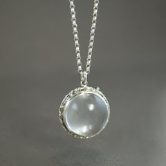 Pools of light sterling and Quartz locket