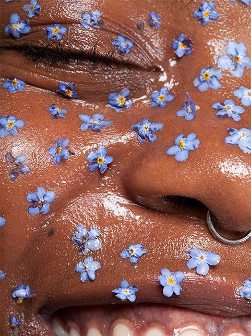 hydration small blue flowers on womans face