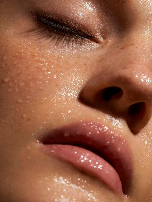 woman with water droplets on face