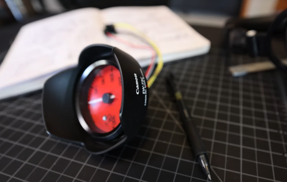 camera lens hood installed on the gauge