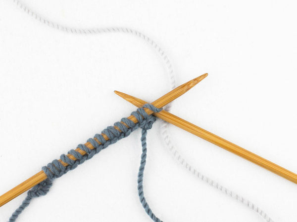 Step 2: Knit one stitch.