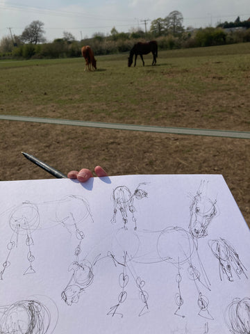 Photo of Roxanne Gooderham drawing horses from life.