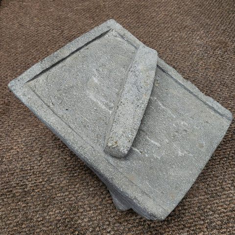 metate made in Mexico for grinding corn or grain