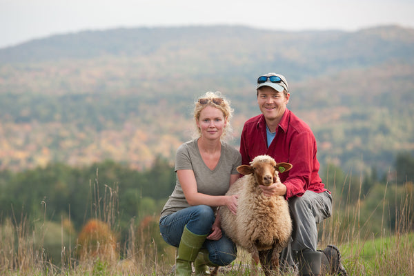 Ben and Grace Machin of the Tamarack Vermont Sheep Farm with a Tunis Lamb