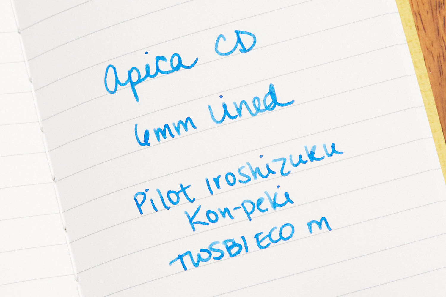 Writing sample in an open Apica CD-7 lined notebook