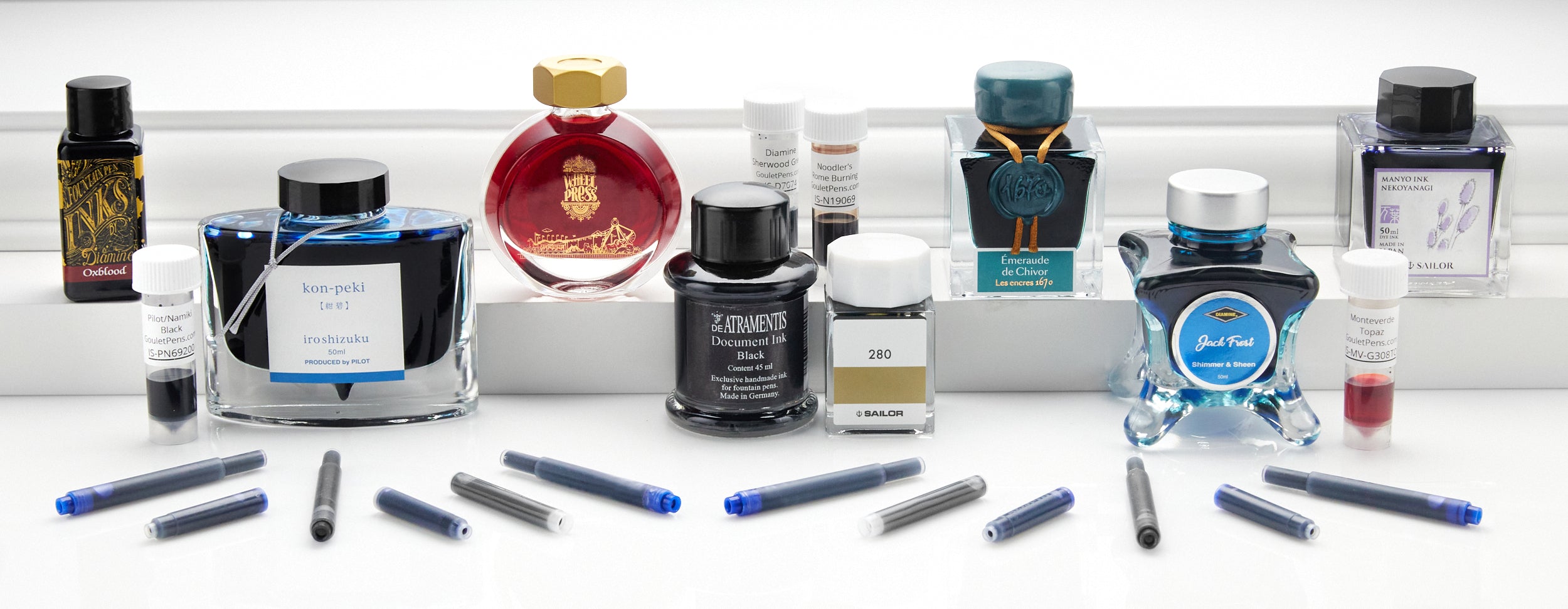 A variety of fountain pen ink bottles and cartridges
