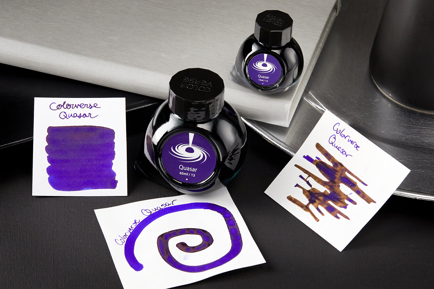 Colorverse Quasar Ink bottles with ink splatters