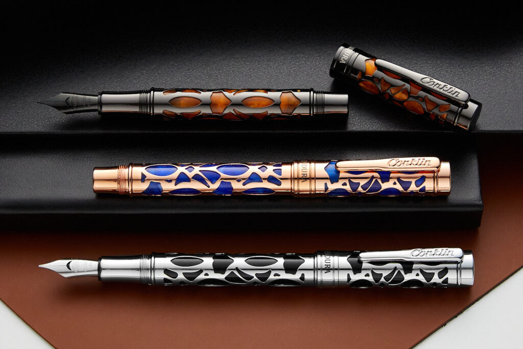 3 Conklin Decocrest- orange, blue and black on black notebooks