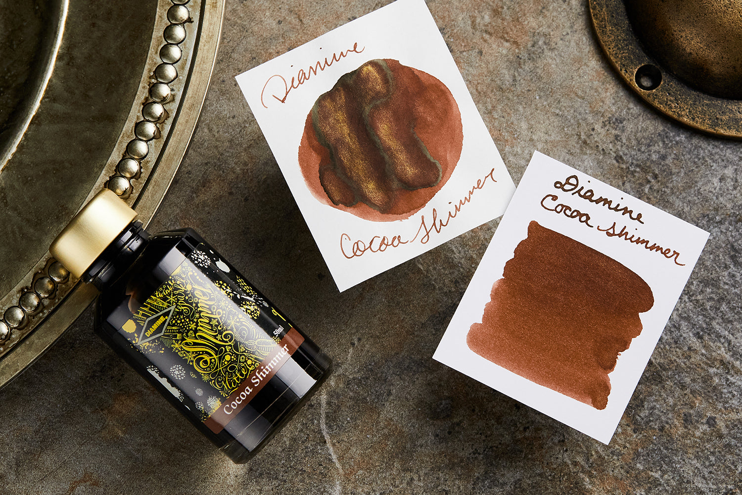 Diamine Cocoa Shimmer fountain pen ink with ink splatters