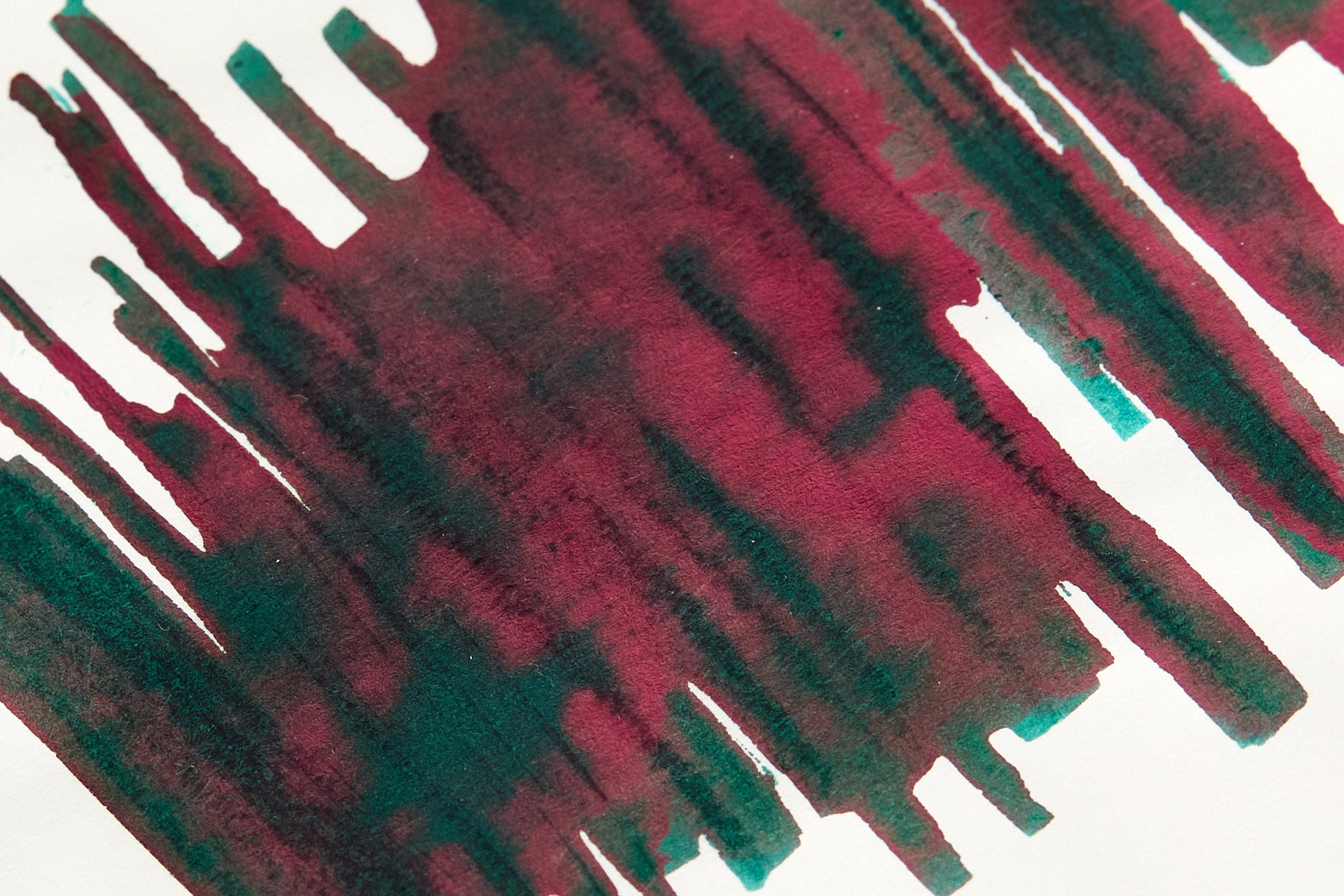Diamine Holly Fountain Pen Ink swab upclose with lots of red sheen on green ink