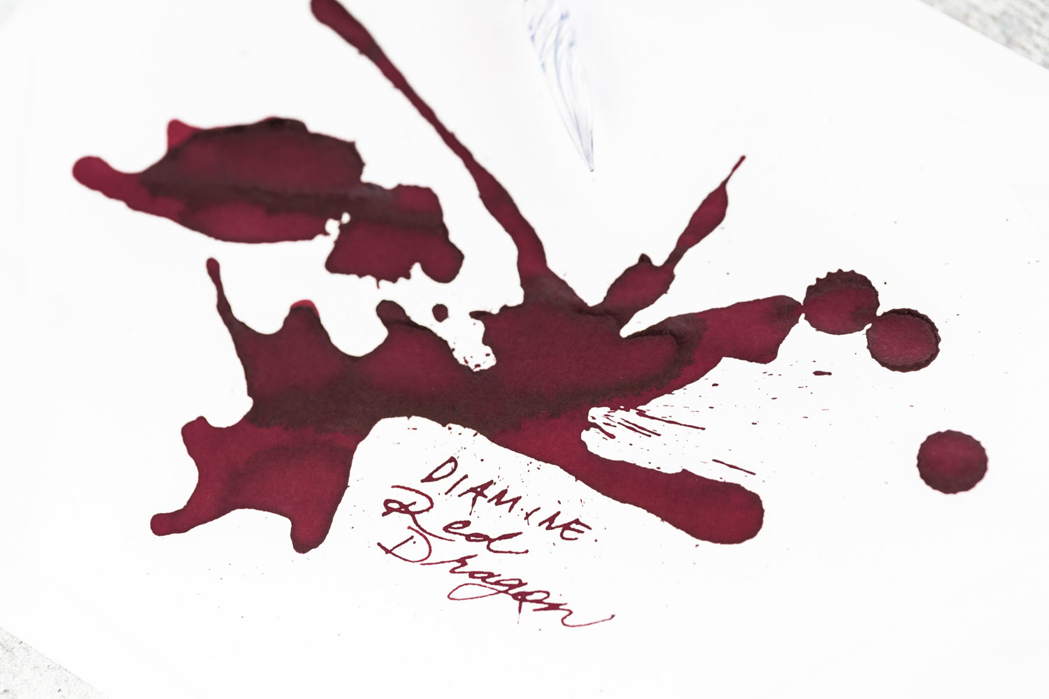 Ink splatter of Diamine Red Dragon