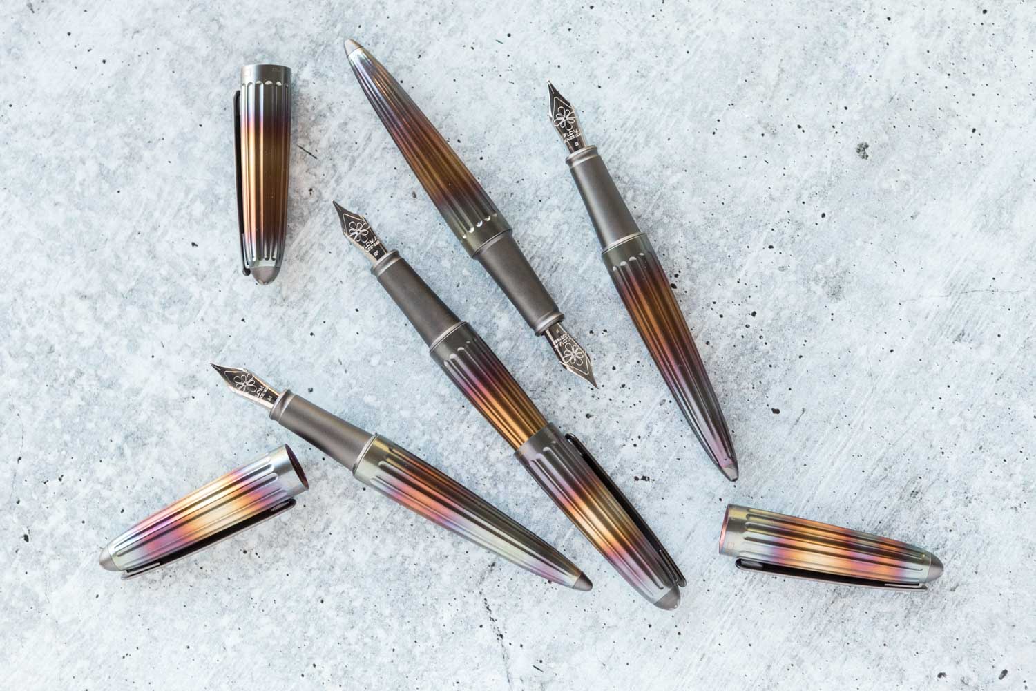 4 Diplomat Aero Fountain Pens in Flame on white background