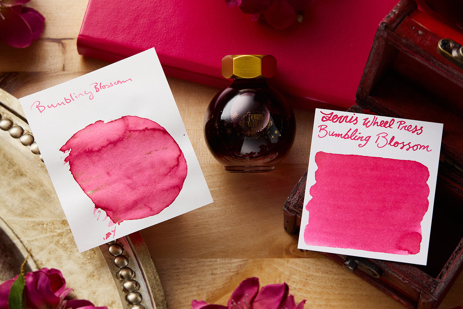 Ferris Wheel Press Bumbling Blossom ink bottle with ink splatters.