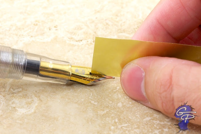 Goulet Brass Sheets flossing a fountain pen nib tine