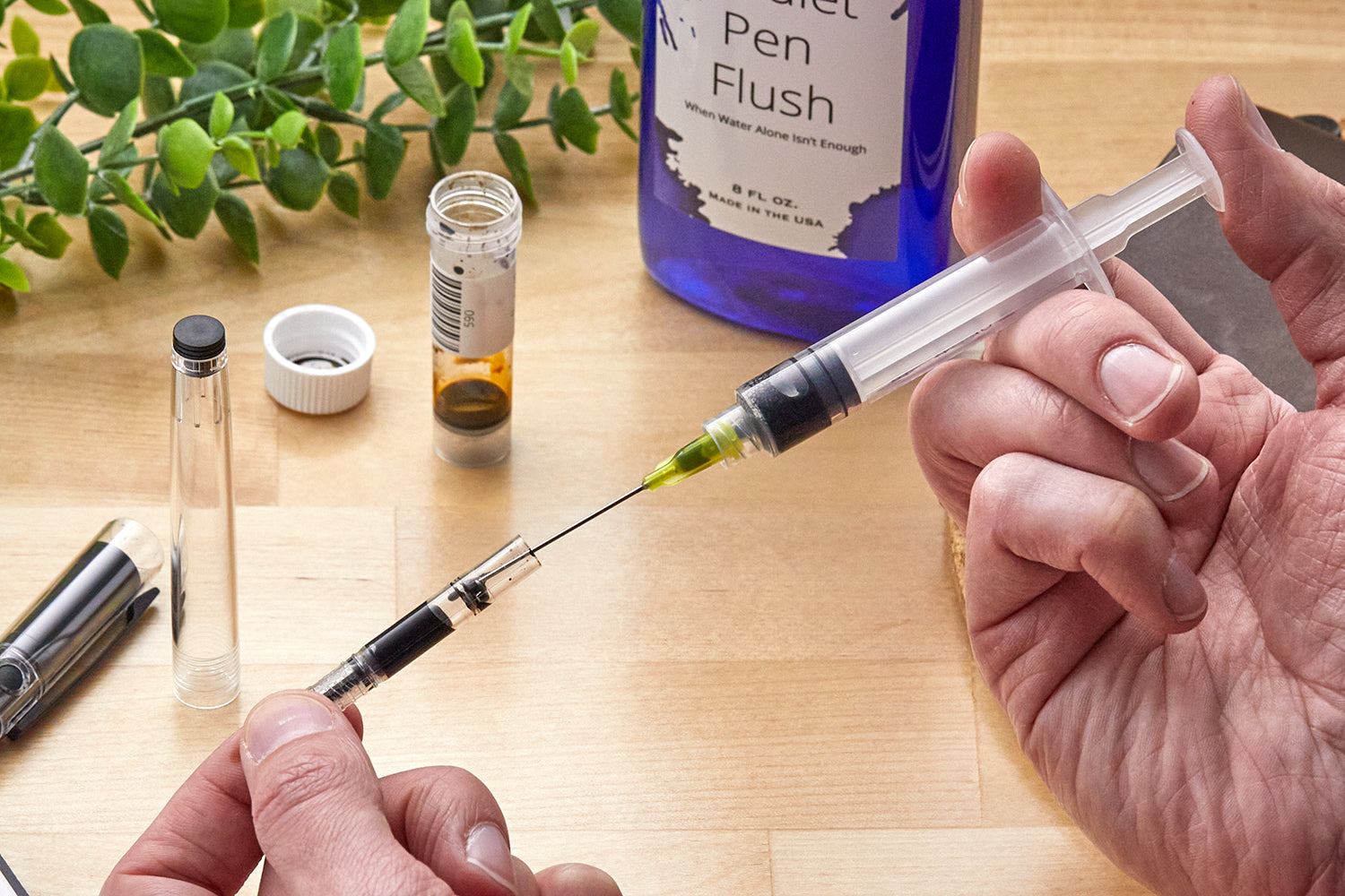 Filling an ink converter with a syringe