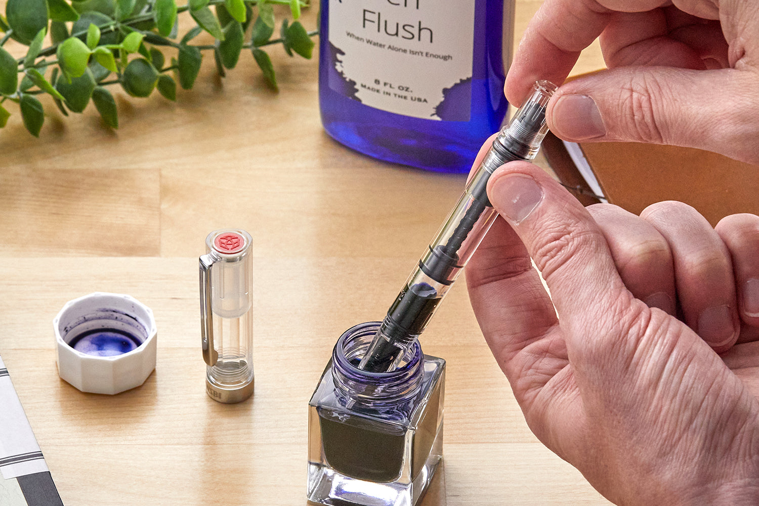 Filling a fountain pen from an ink bottle