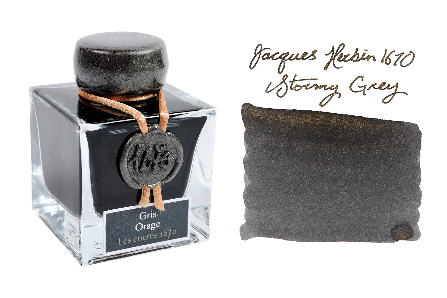 Jacques Herbin 1670 Stormy Grey fountain pen ink bottle and swab on white background