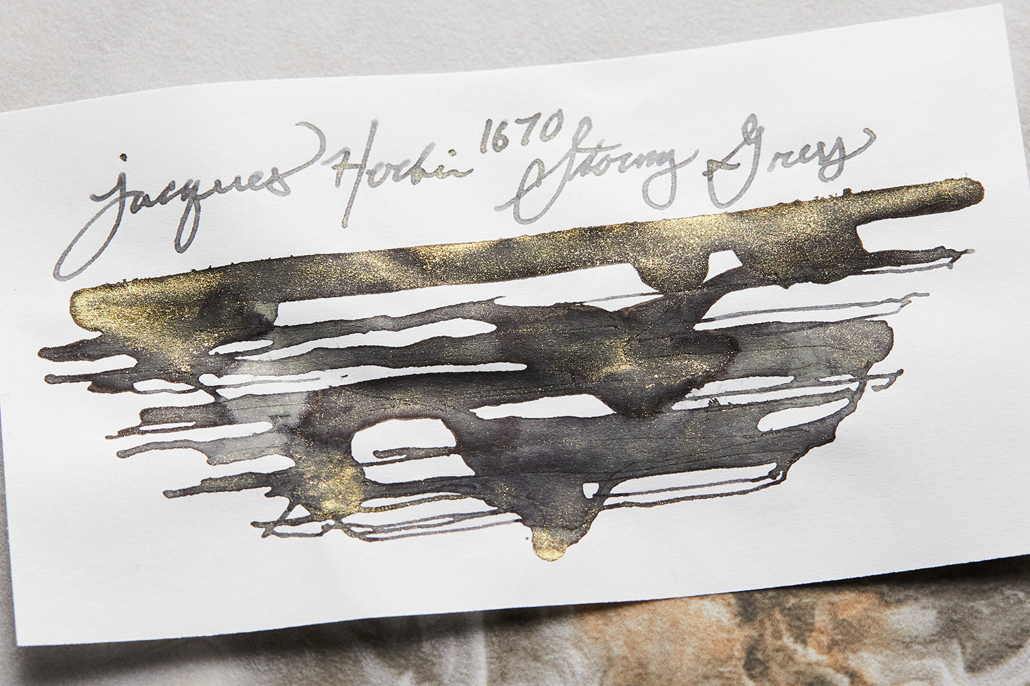 Jacques Herbin 1670 Stormy Grey fountain pen ink scratchy blob on light colored background
