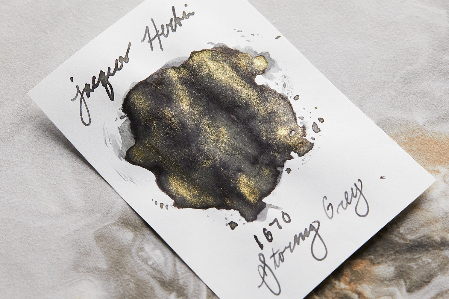 Jacques Herbin 1670 Stormy Grey fountain pen ink blob on light colored background