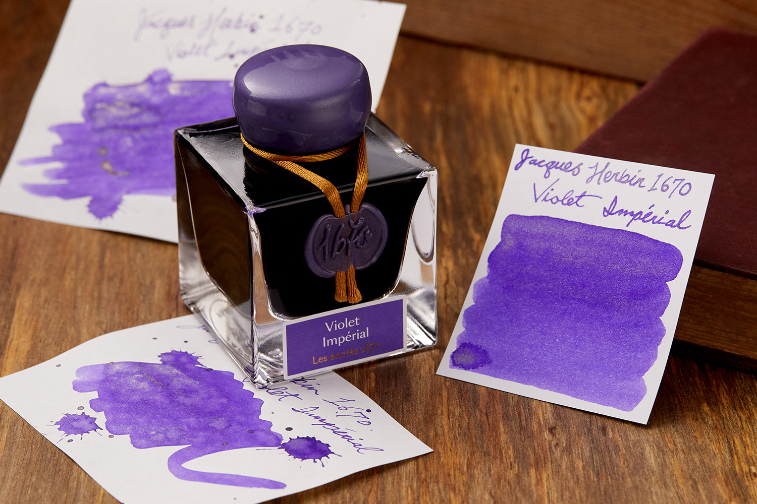 Bottle of Jacques Herbin 1670 Violet Imperial 50ml fountain pen ink with matching ink swabs