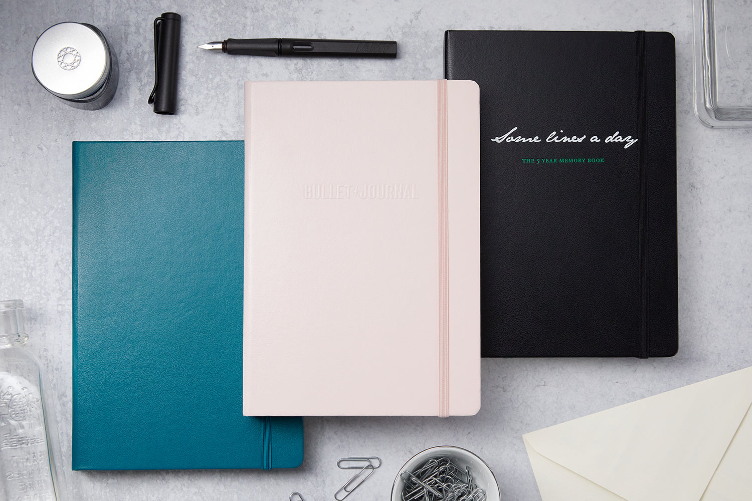 Three closed Leuchtturm1917 notebooks on a desk