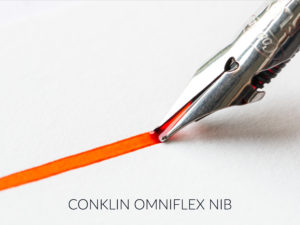 Nib flexing with orange ink coming out of the nib