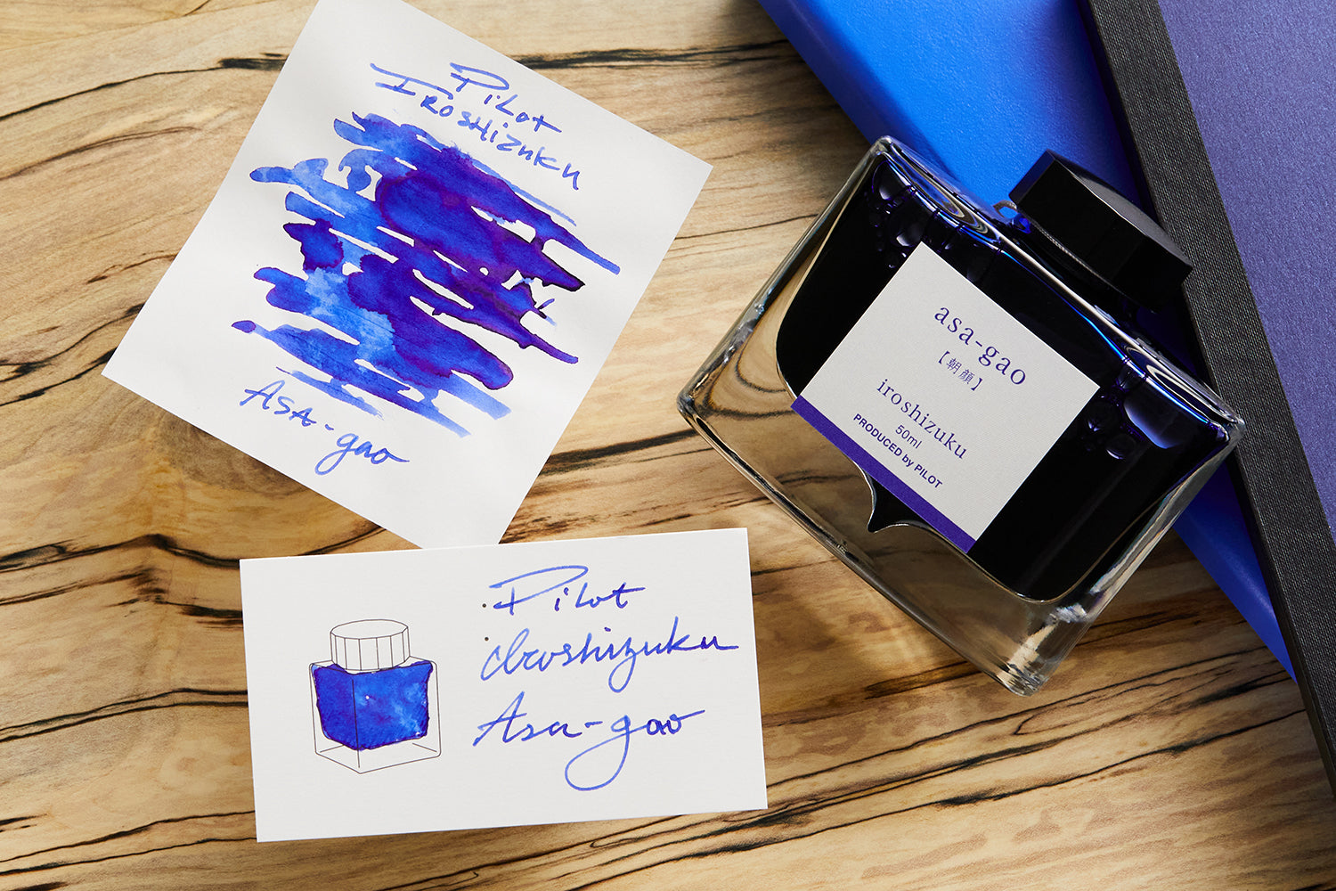 Pilot Iroshizuku Asa-Gao with bottle and various examples