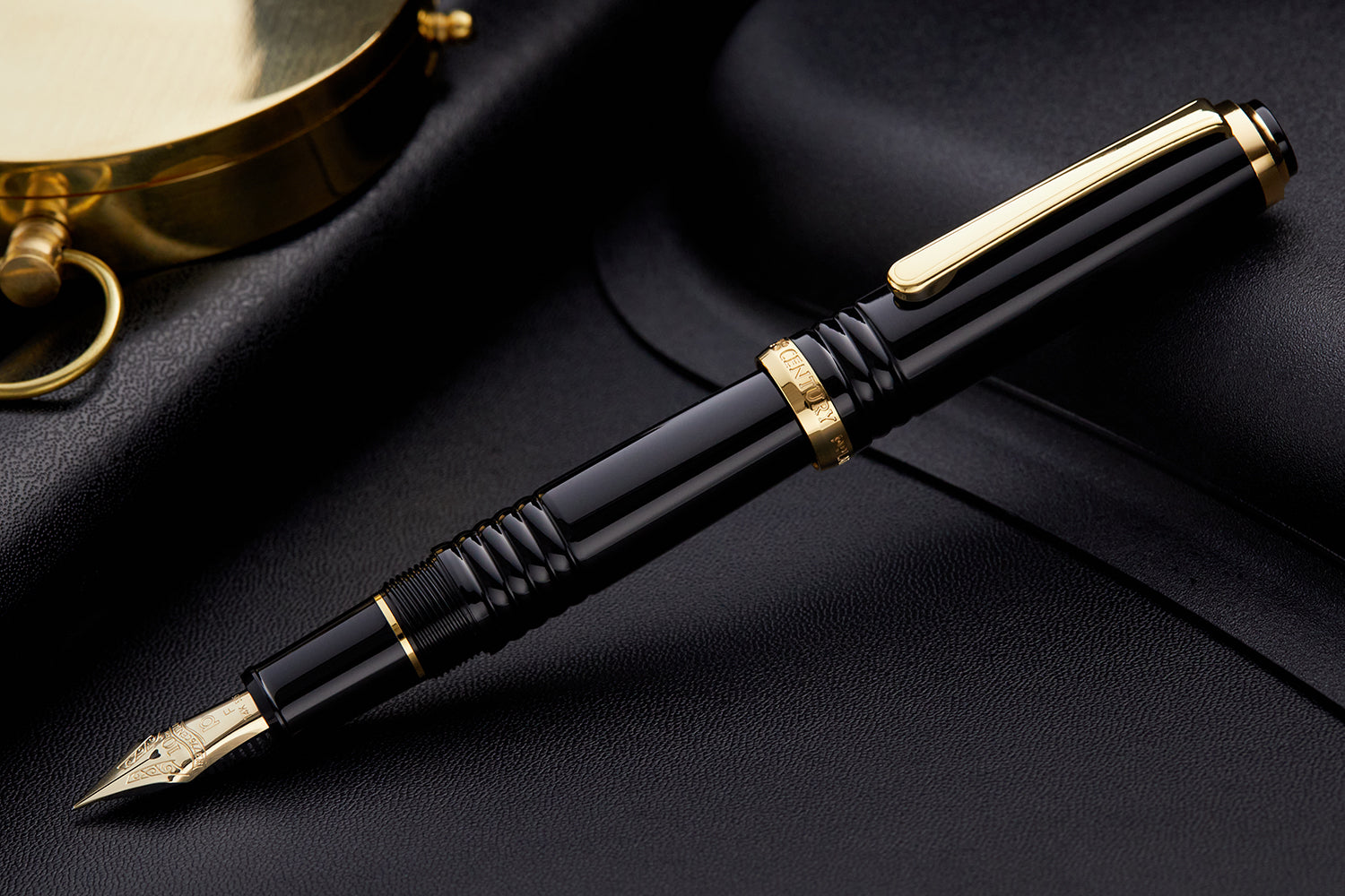 Platinum 3776 10th anniversary black fountain pen with a gold nib and gold trim