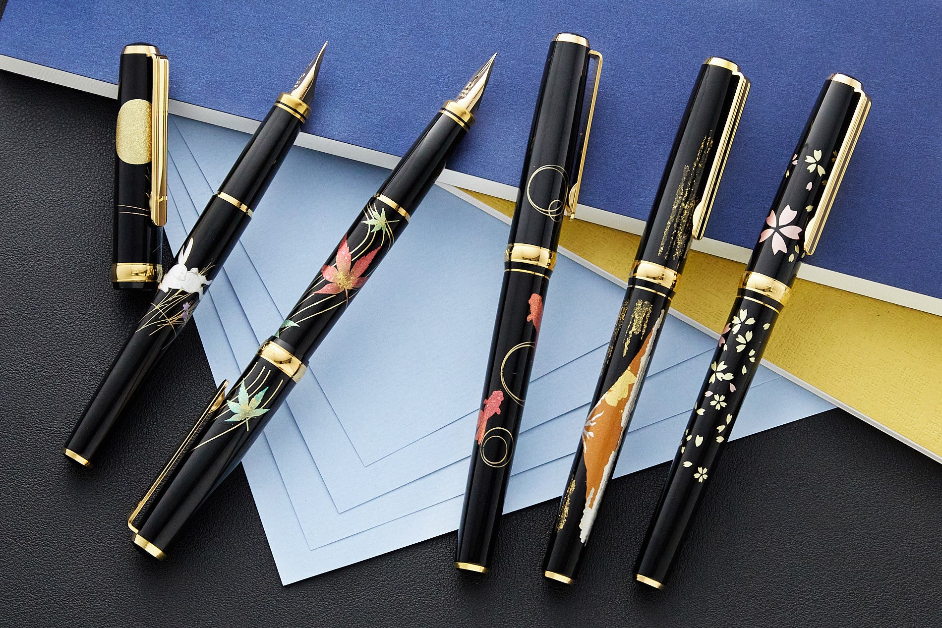 Black fountain pens with nature/season maki-e designs