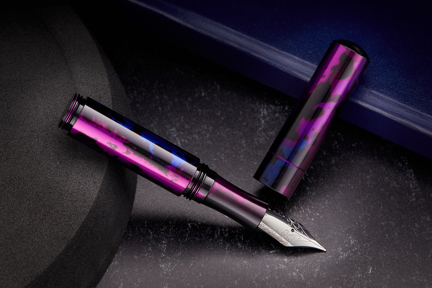 Schon fountain pen, uncapped, black and purple background