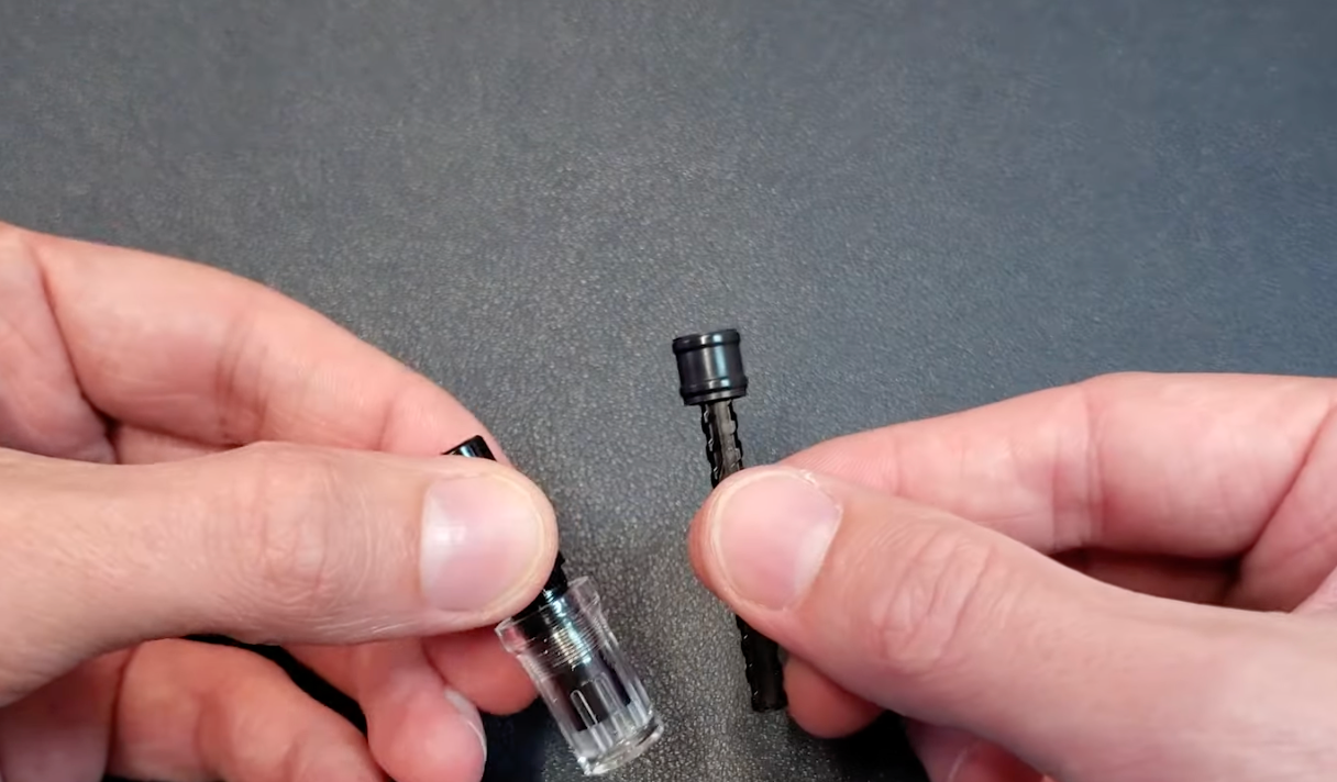 components of the TWSBI ECO fountain pen taken apart on a dark blue backgroundWrench on TWSBI ECO piston