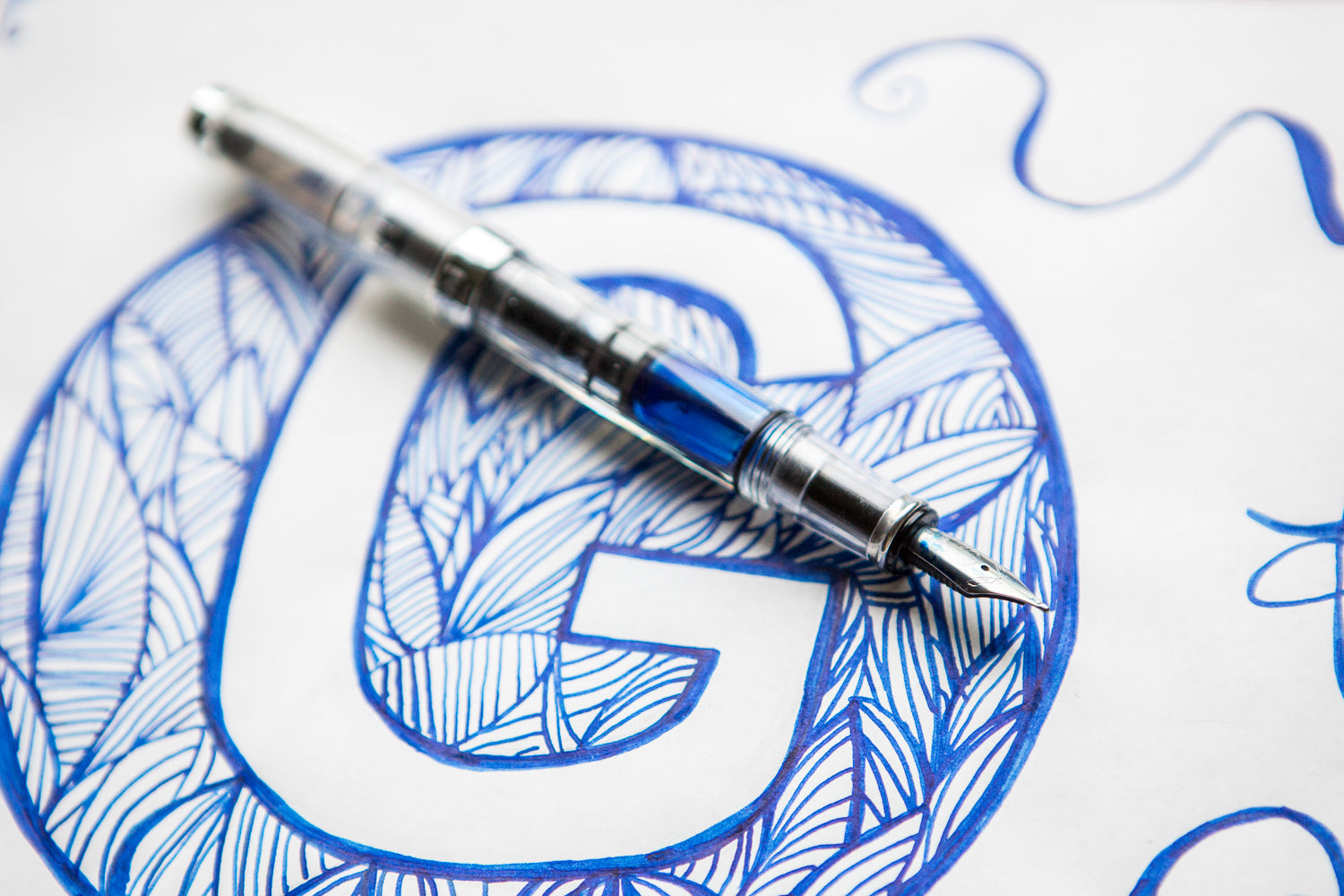 TWSBI Mini fountain pen on drawing of a G