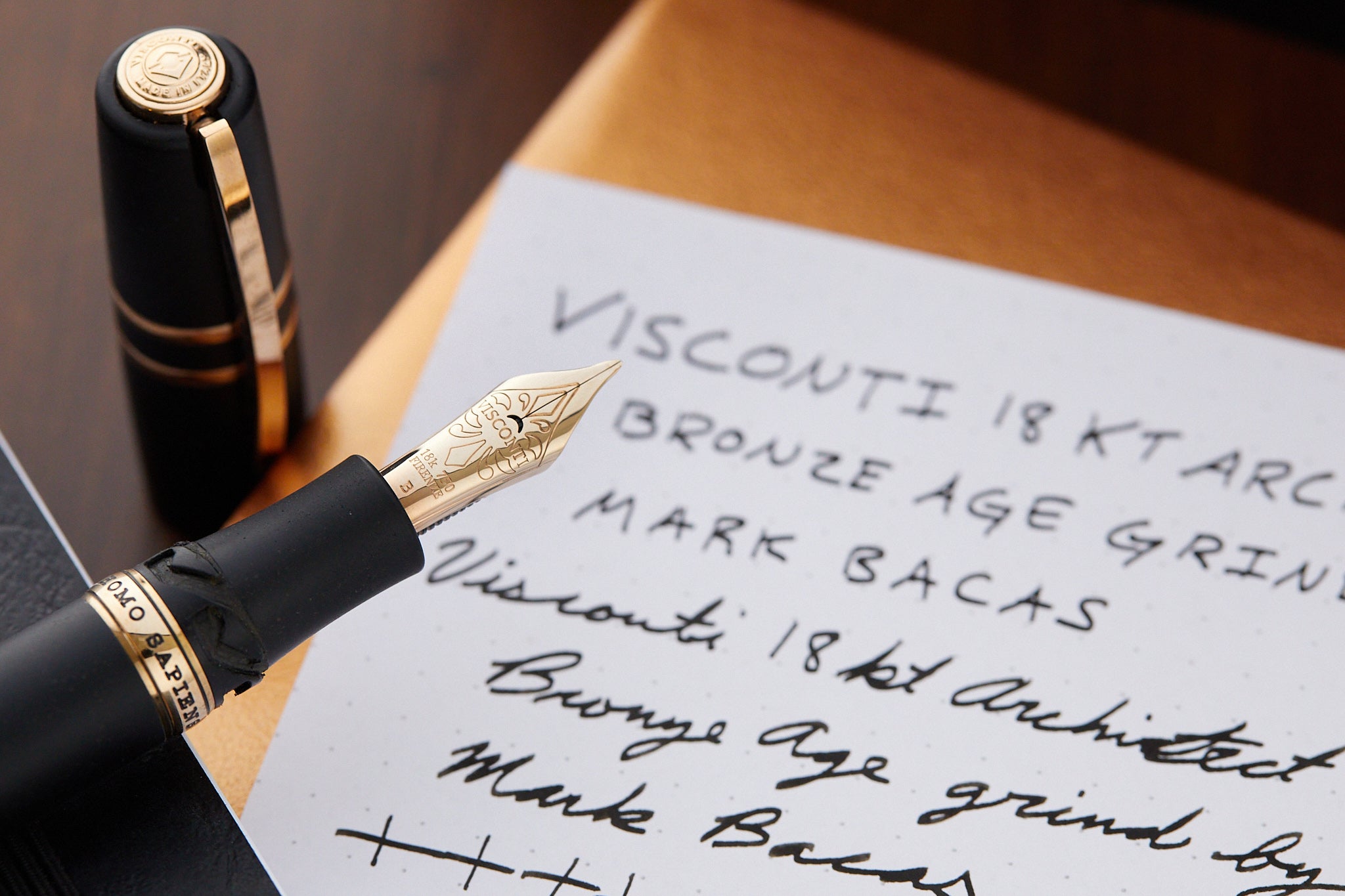 Visconti Homo Sapiens fountain pen with architect nib grind and writing samples in background