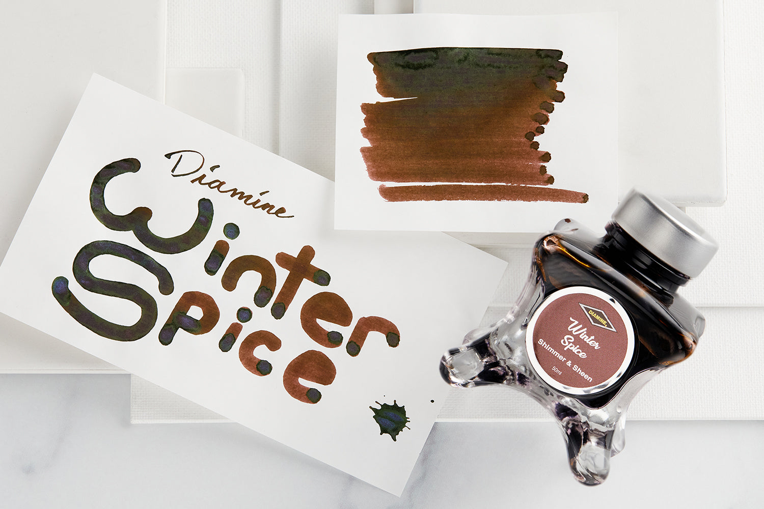 Diamine Winter Spice bottle with examples