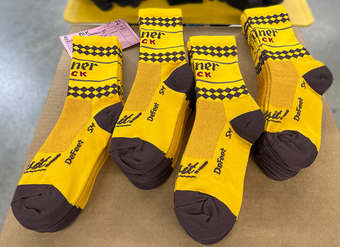 Shiner Bock custom socks in yellow with black heel and toe