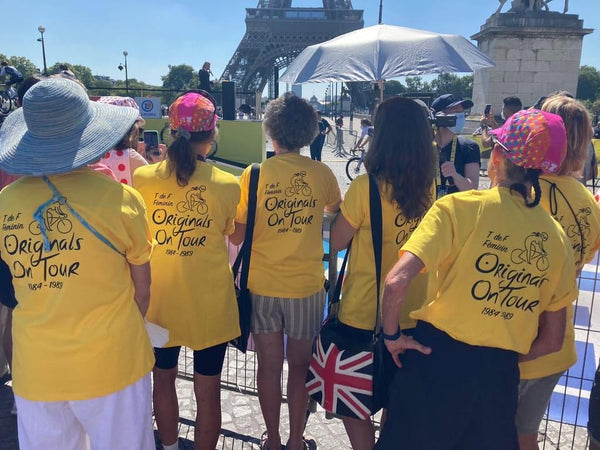 The "Originals"--members of the British team that competed in the Tour de France Féminin, watch the start of the Tour de Femmes Avec Zwift in Paris