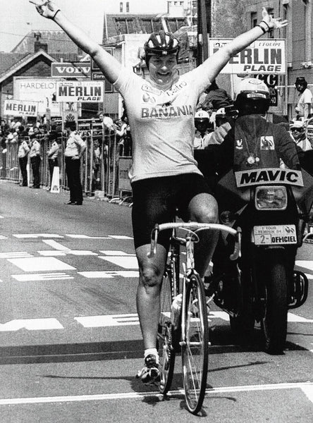 Dutch rider Mieke Havik crosses the finish line at the 1984 Tour de France Féminin. Havik is the first woman to wear the yellow jersey.