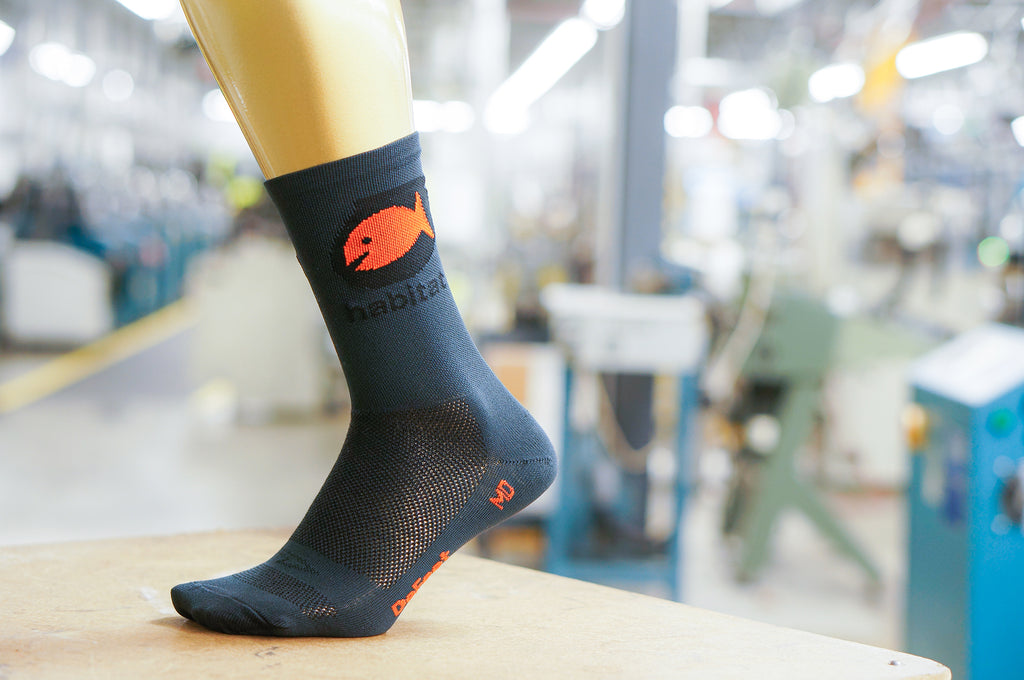 custom DeFeet cycling sock for Habitat with a fish icon on the side